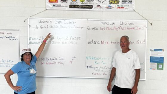 Dawn pointing to sponsor banner